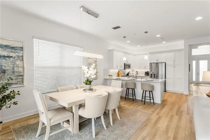 Dining space featuring light wood-style floors and recessed lighting