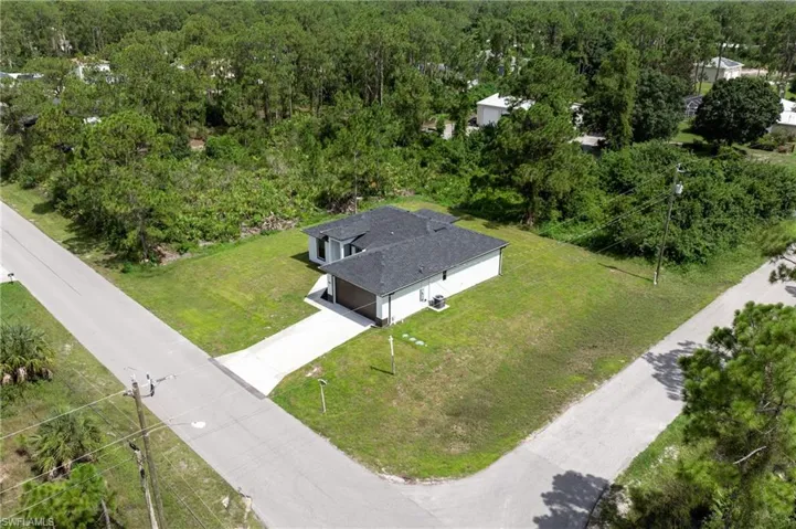 View of subject property with a heavily wooded area