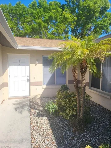 View of exterior entry featuring stucco siding