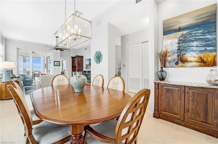 The formal dining area provides an ideal setting for hosting larger gatherings and is complemented by a built-in buffet for added storage and serving space.