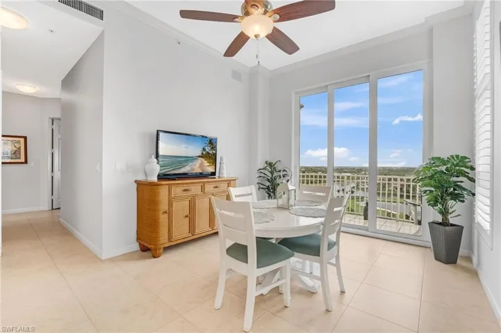 The charming breakfast area captures stunning views of the lake, golf course, and downtown Fort Myers, creating the perfect setting for relaxed morning coffee or intimate dining with family and friends.