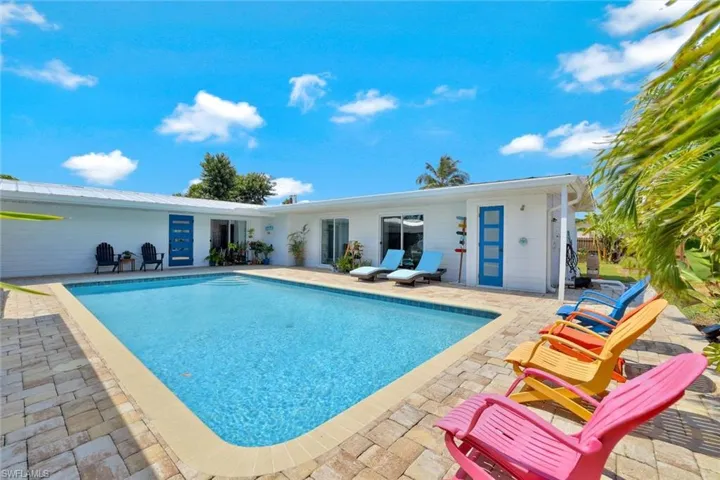 View of swimming pool with a patio area