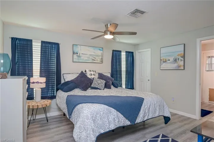 Bedroom featuring light wood-style floors and ceiling fan