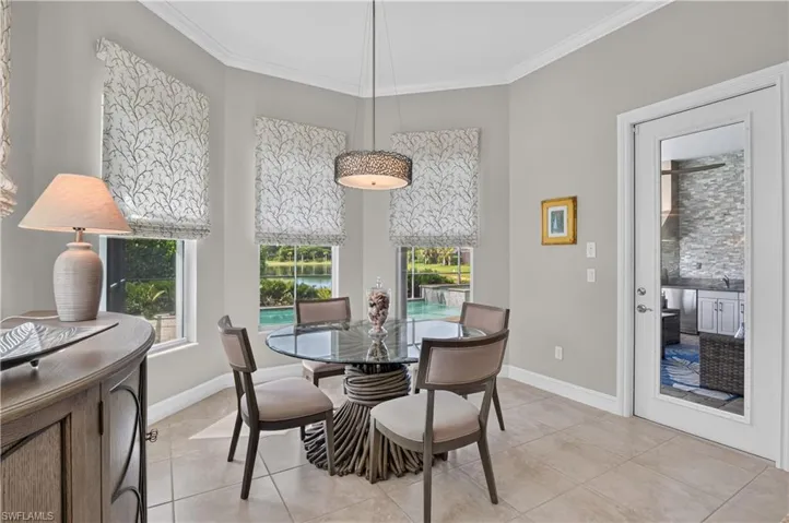 Large informal dining area overlooks the pool.