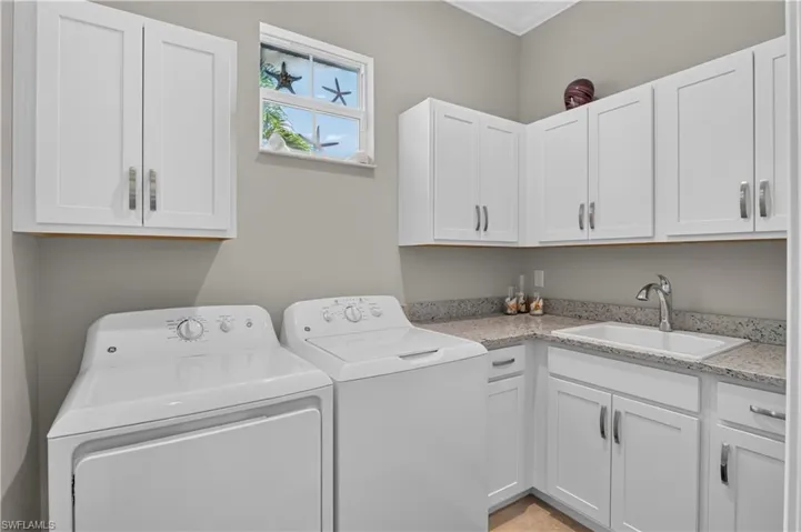 Slop sink and massive storage, window for natural light.
