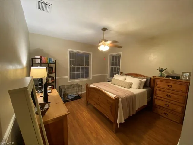 Bedroom with wood finished floors and ceiling fan