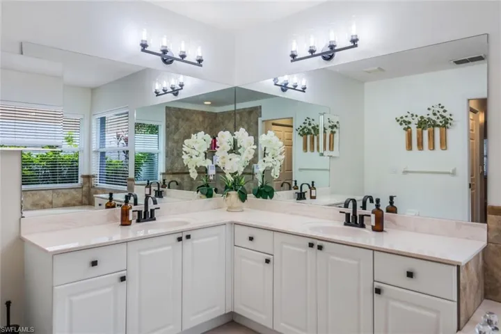 Bathroom featuring dual sinks and oversized vanity