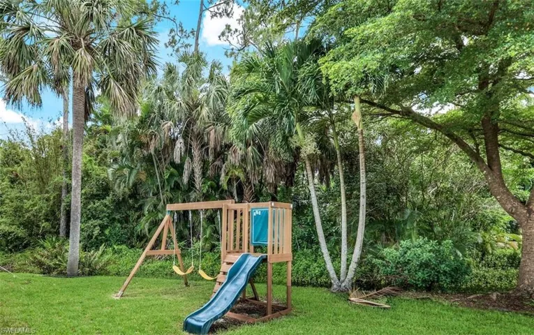 View of playground with a yard