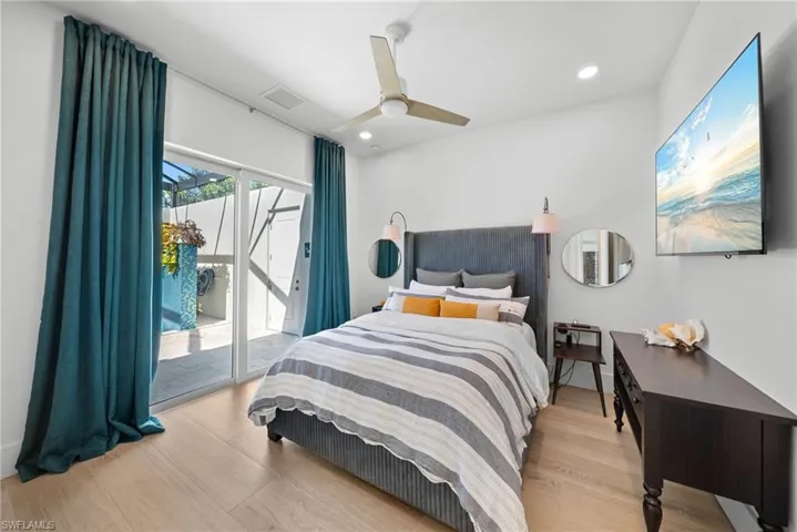 Bedroom with access to outside, light wood-style flooring, recessed lighting, and ceiling fan