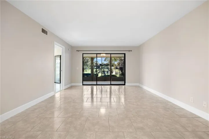 Living area with Sliders going out to covered Lanai