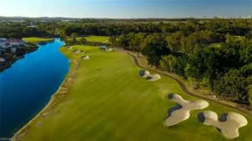 Bird's eye view of a large body of water and a local golf course