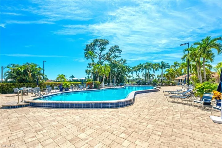 Community pool featuring a patio