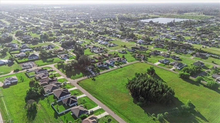 View of property location with nearby suburban area and a nearby body of water