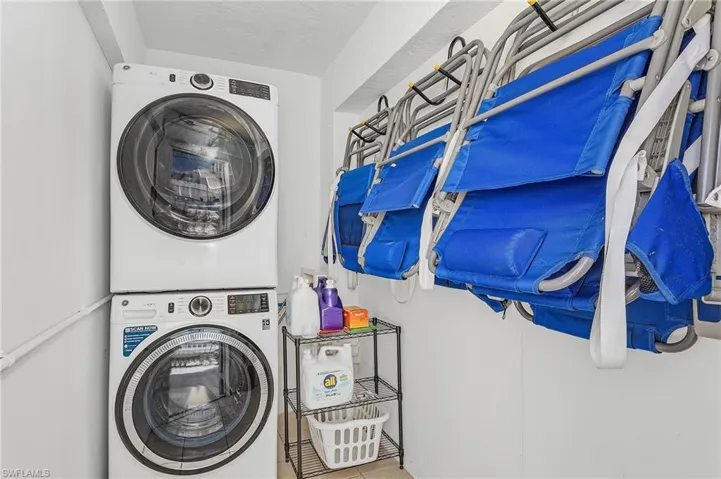 Laundry room with storage for beach chairs and umbrellas