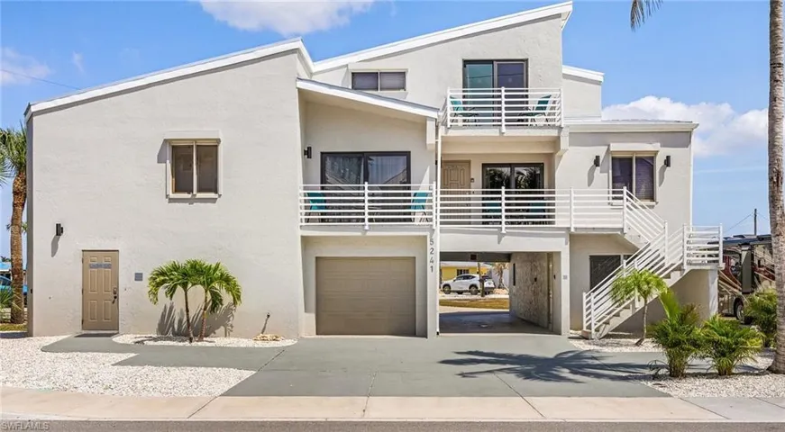 Casa Bella front elevation - Drive through garage and balconies