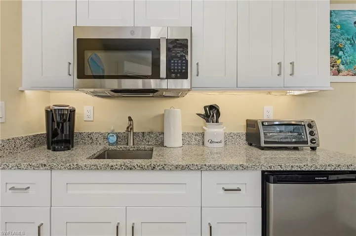 Casa Bella D Morning kitchen with granite countertop and SS appliances