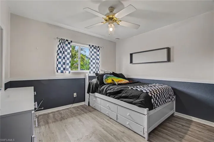 Bedroom with light wood-type flooring and ceiling fan
