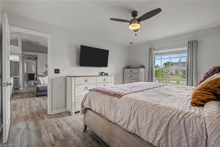 Bedroom with wood finished floors and ceiling fan