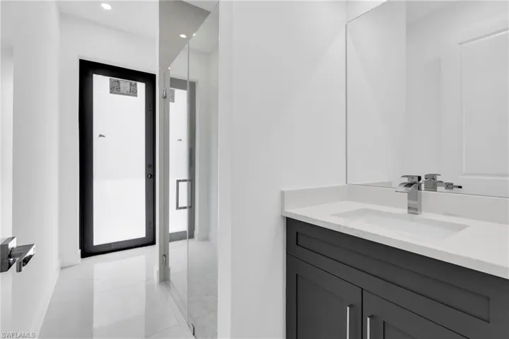 Bathroom with vanity, recessed lighting, and tile patterned floors