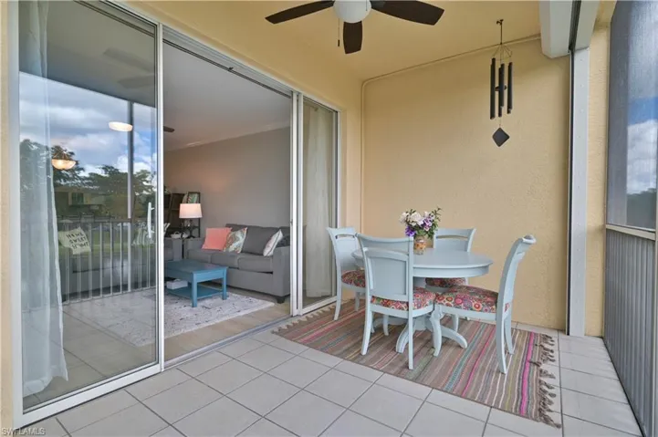 Lanai features large sliders with view of the serene lake.