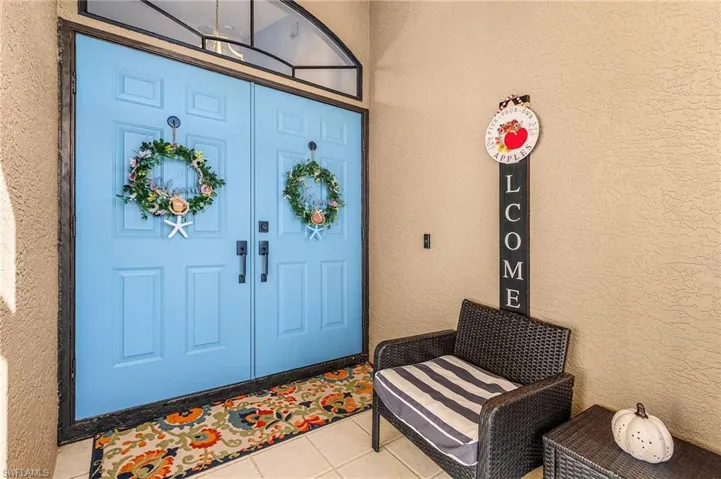 Property entrance with stucco siding