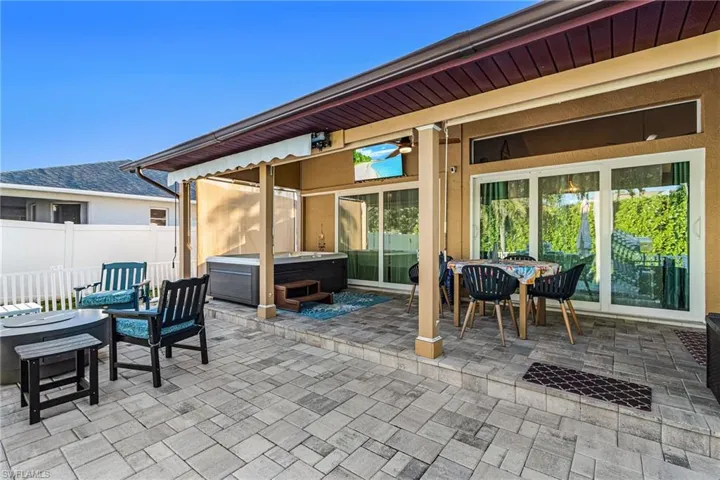 View of patio / terrace with a hot tub