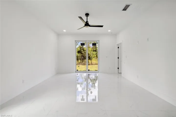Spare room with ceiling fan