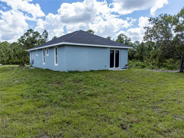 View of home's exterior featuring a lawn