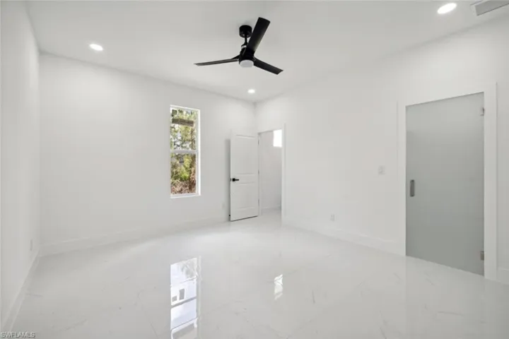 Spare room featuring ceiling fan