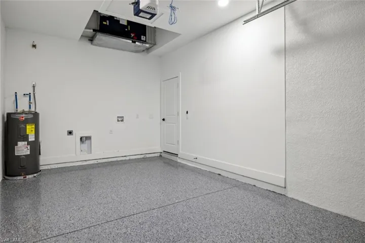 Garage with a garage door opener and water heater