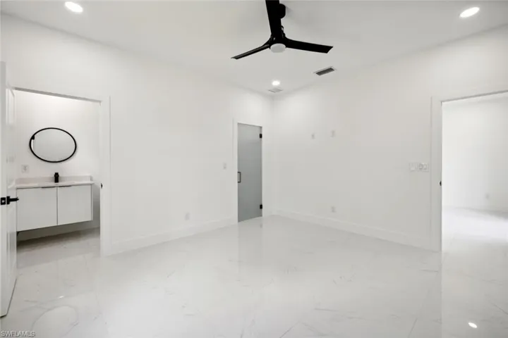 Unfurnished bedroom with ceiling fan