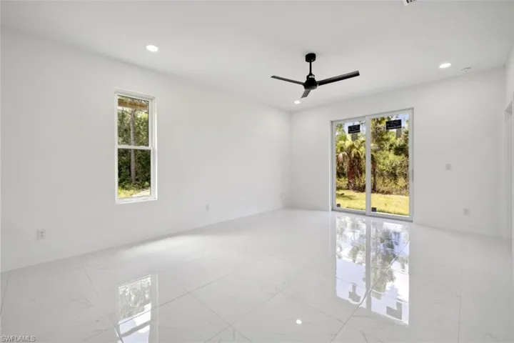 Spare room with ceiling fan