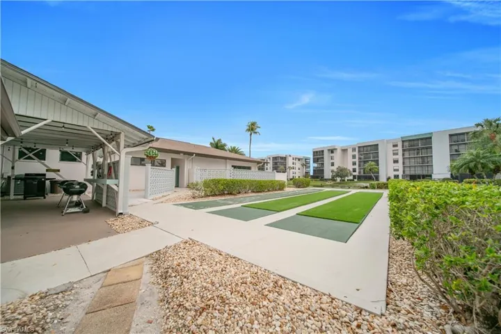 View of property's community with shuffleboard
