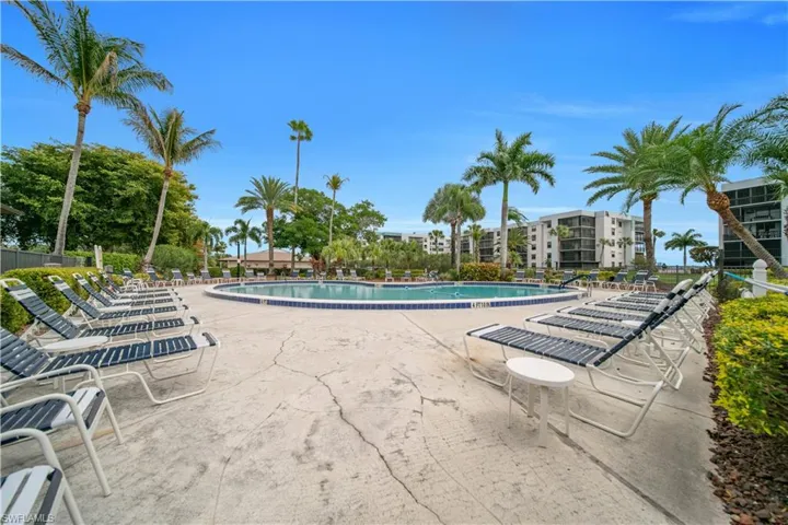 Community pool featuring a patio