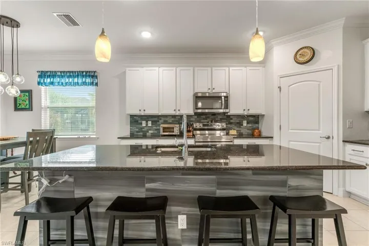 Kitchen with Large Island, Granite Countertops & Stainless Steel Appliances