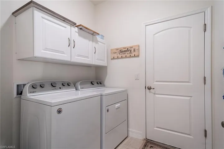 Laundry Area with Washer, Dryer & Cabinets for Storage