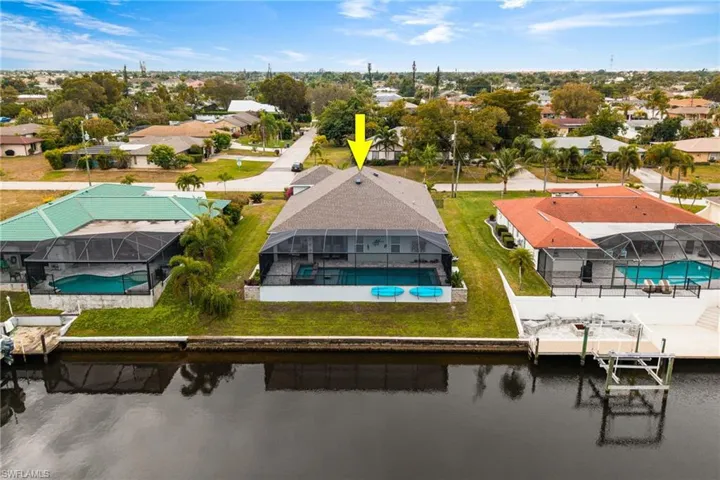 Back of Home with Screened Lanai, Large Pool & Spa, Kayaks & Seawall on Gulf Access Canal