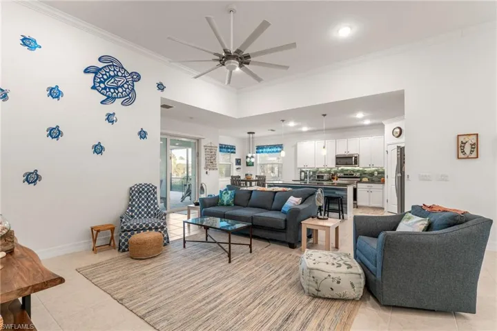 Spacious Living Area with Volume Ceilings & Tile Floors Throughout