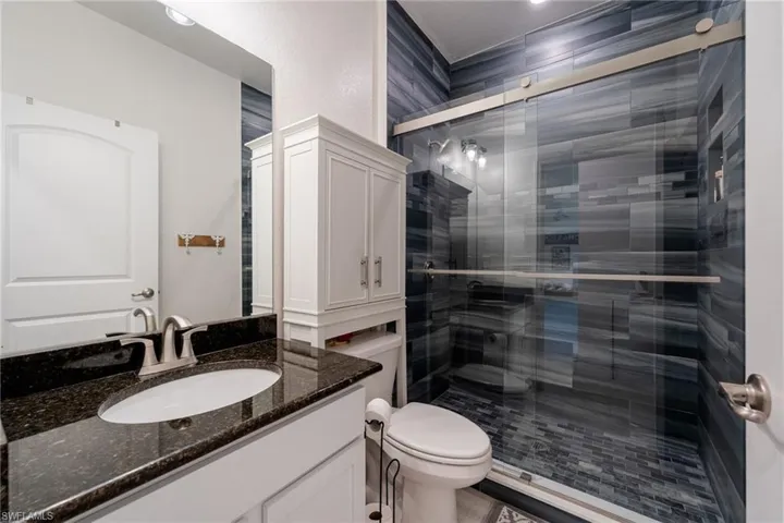 Bathroom with large shower for guest bedroom