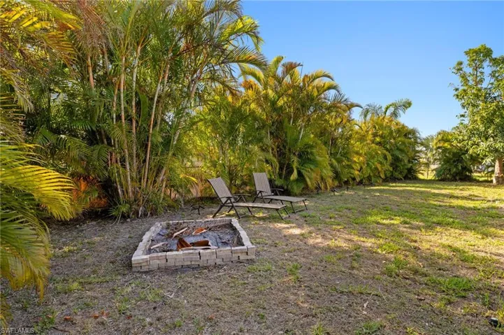View of yard featuring a fire pit