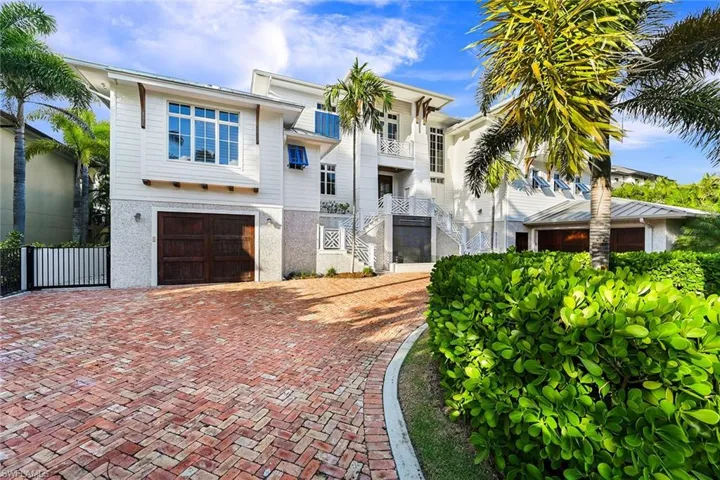 Exterior with circular drive and access to 12 car garage