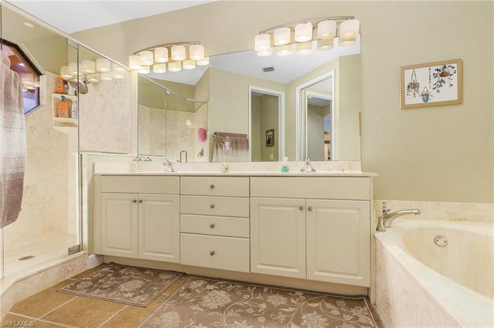Enjoy his & hers sinks, soaking tub and walk-in shower.