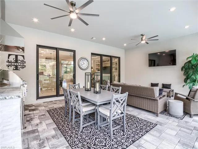 Dining space featuring ceiling fan and light tile patterned floors
