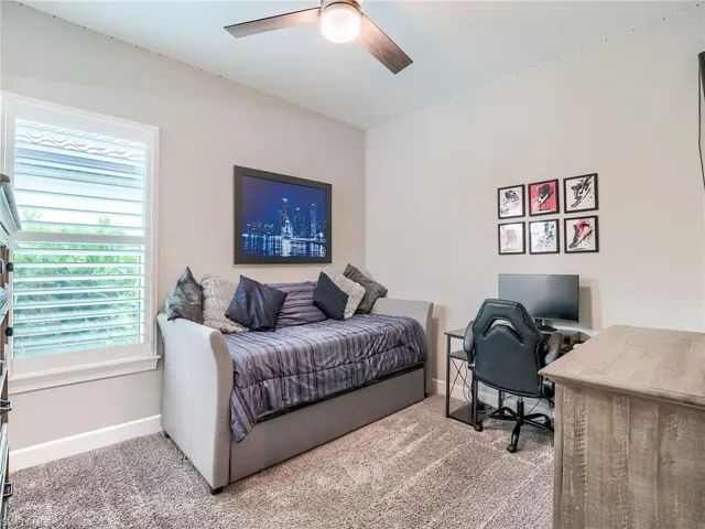 Bedroom featuring carpet flooring and ceiling fan