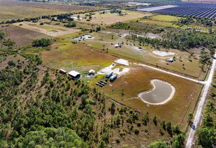 Aerial view of property and surrounding area with rural landscape