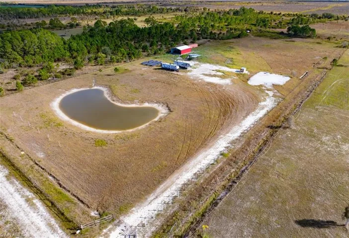 Aerial view of property and surrounding area with rural landscape