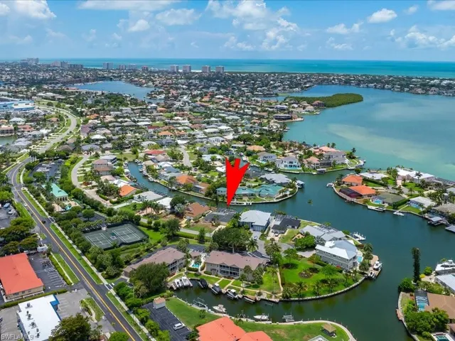 Aerial view of residential area with a nearby body of water
