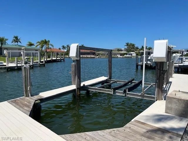 Dock with a water view and boat lift