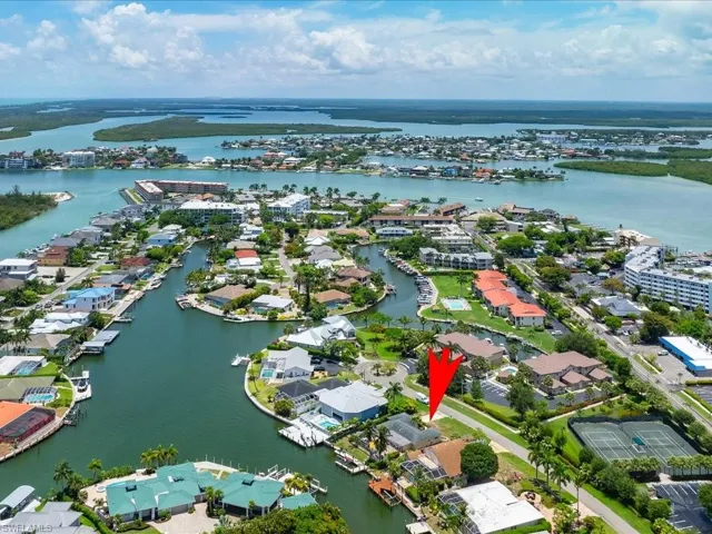 Aerial overview of property's location featuring a nearby body of water