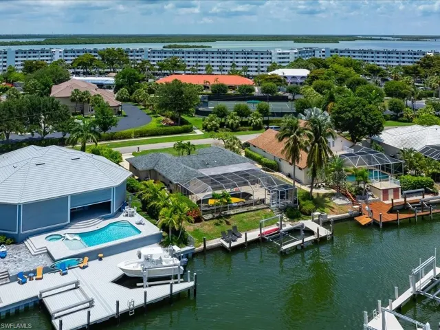 Aerial view of a nearby body of water and a pool